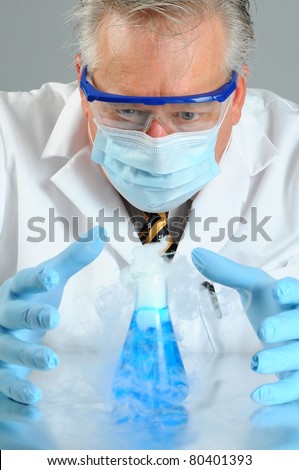 A Mad Scientist looks at his experiment as it bubbles and smokes on his lab table.
