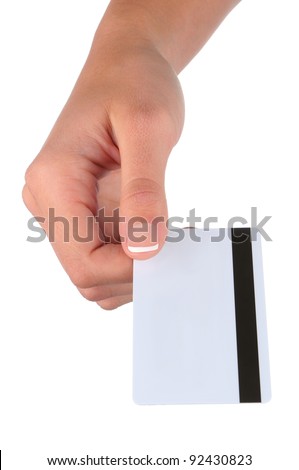 Closeup of a woman's hand holding a credit card with the magnetic strip facing up. Vertical format over a white background
