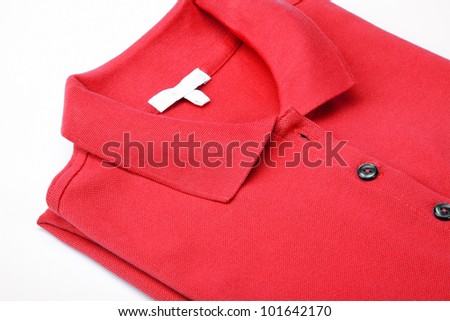 Detail of a red polo shirt.