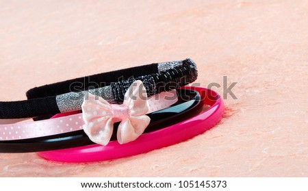 Four hair-bands on pink.
