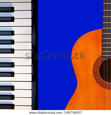 Acoustic guitar, piano keys on blue.