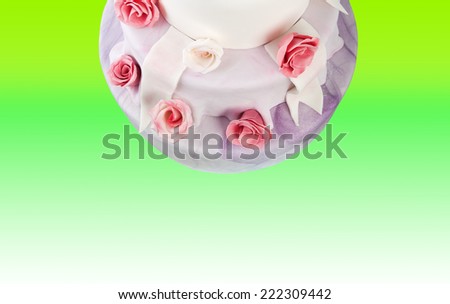 Detail of wedding cake with pink roses with  space for your text or logo.