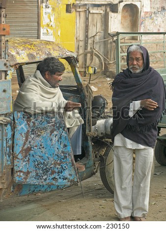 Two old men discussing life in a Tuk Tuk. Jaipur, India.