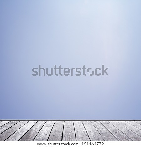 wood floor and clear blue sky background