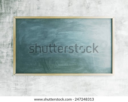 green chalk board with chalk traces and wooden frame