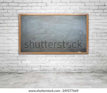 chalk board with chalk traces on brick wall