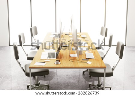 meeting conference table with office accessories and computers