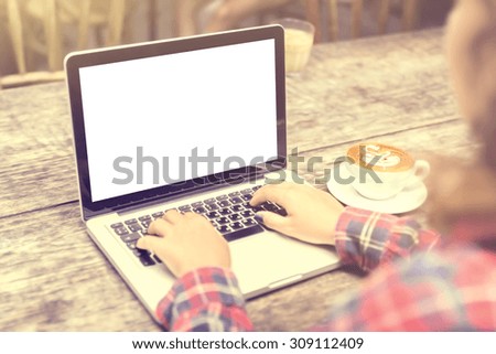 girl with a cup of coffee and a blank laptop, mock up