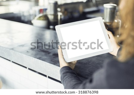girl with blank digital tablet in cafe, mock up