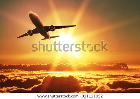 Plane takes off at sunrise