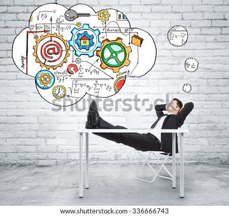 Man sitting at the table and thinking about creating a business plan