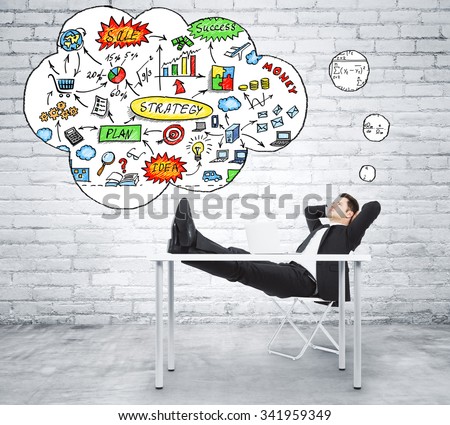 Businessman thinking about business strategy plan in loft style office
