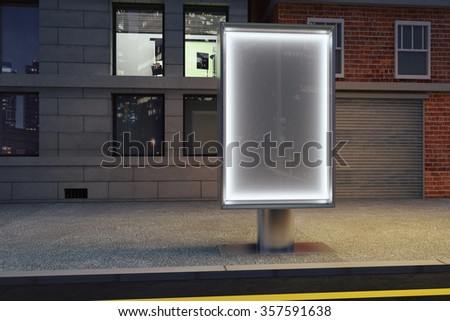 Blank glowing billboard on empty street at night, mock up