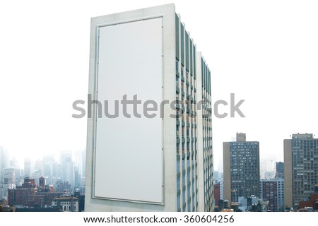 Large billboard on the wall of a building in the background of the city, mock up