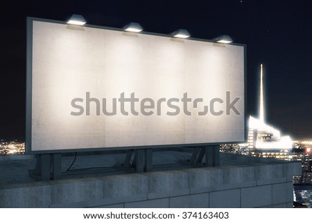 Large blank billboard on a building roof at evening, mock up