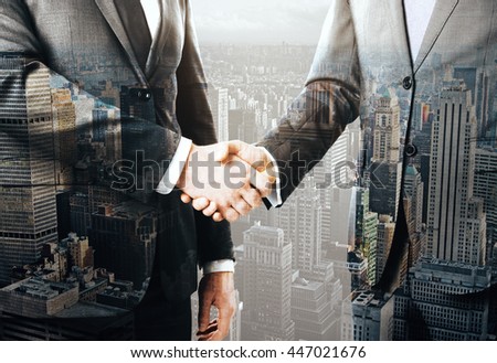Business people shaking hands on New York city background. Concept of partnership. Double exposure