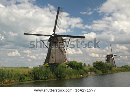 KINDERDIJK - SEPTEMBER 17: Windmills in Kinderdijk, Netherlands on September 17, 2009.The dutch windmills at Kinderdijk in the Netherlands. One of the most famous dutch attraction.