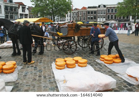 GOUDA - JULY 23: Cheese market in Gouda, Netherlands on July 23, 2009. Traditional cheese market in Gouda. Every thursday morning there is a typical cheese market at Gouda.