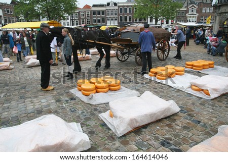 GOUDA - JULY 23: Cheese market in Gouda, Netherlands on July 23, 2009. Traditional cheese market in Gouda. Every thursday morning there is a typical cheese market at Gouda.