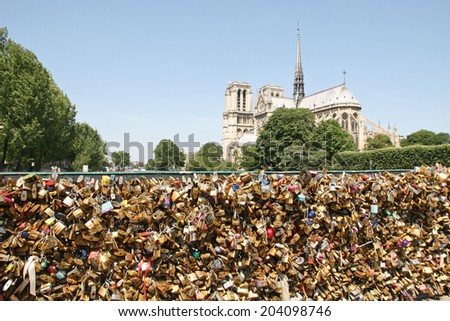 PARIS, FRANCE - JUNE 2014: Love padlocks on the  Pont de l'Archeveche brigde in Paris , June 12, 2014