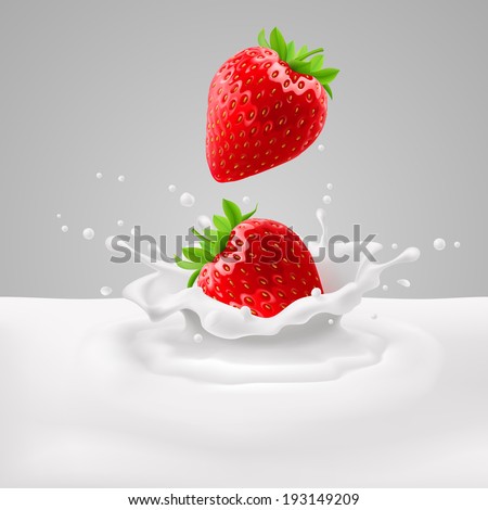 Appetizing strawberries with green leaves falling into milk with splashes