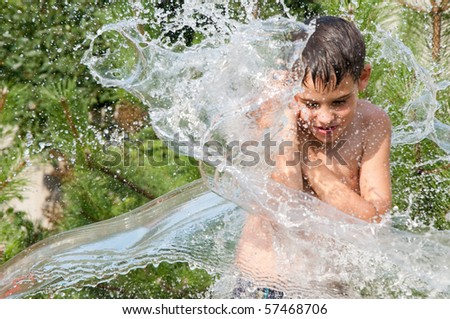 The boy under a jet of water.
