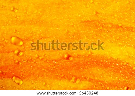 Abstract orange-yellow painted background with water drops (acrylic paint, visible brush strokes)