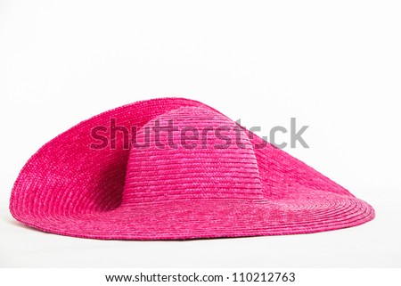 Pink hat being photographed in the studio.