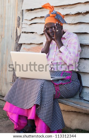 The lady is shocked by what the computer reveals.