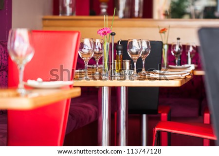 A table plated for four people at the most.