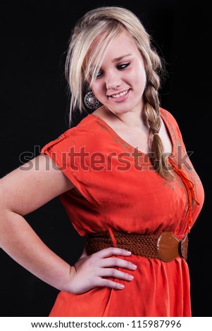 Dressed in a shocking orange dress and brown belt, the girl is showing the country style.