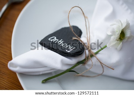 A plate with the guest serviette and name card.