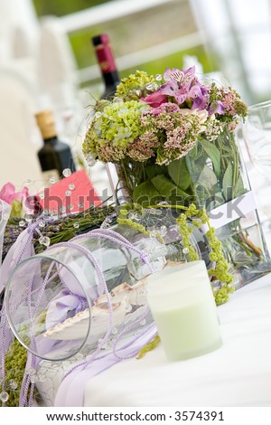 stock photo Wedding table arrangement with flowers and wine