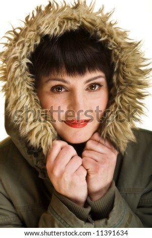 Close up of a woman with red lips wearing a nice warm winter jacket.