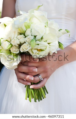 stock photo Closeup of a beautiful wedding bouquet held by the bride