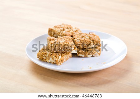 A stack of health biscuits on a white plate.