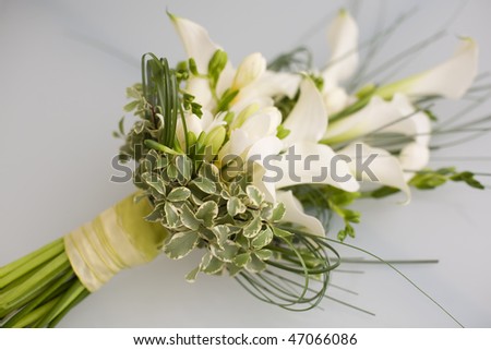stock photo Flowers on Glass table tied up