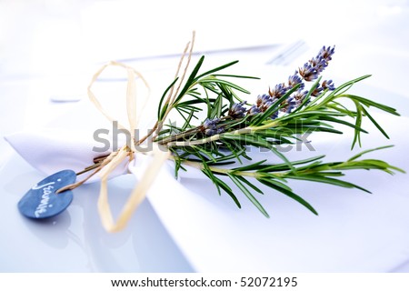 stock photo Table decor at a wedding made of rosemary and lavender tied 
