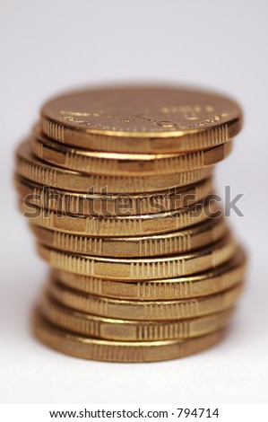 Stack of gold tinted coins. Australian 1 dollar coins. White background.