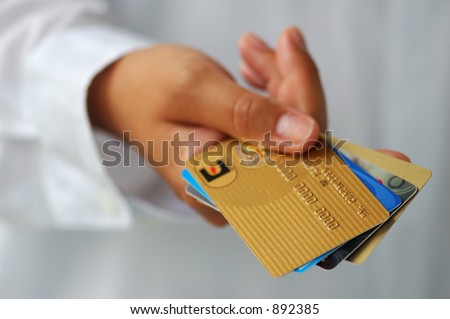 Woman\'s Hand Holding Credit Cards