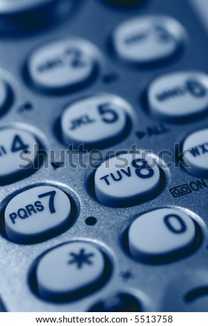 Close-up of Phone Keypad. Very shallow depth of field. Focus on letters RS7 and TUV. Visible texture of plastic.