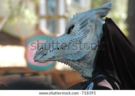 A detailed dragon mask worn as a fantasy costume.