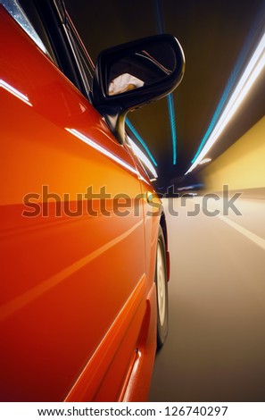 Night driving-dramatic motion blur tunnel light