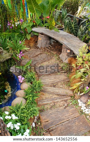 flower garden and handmade wooden bench