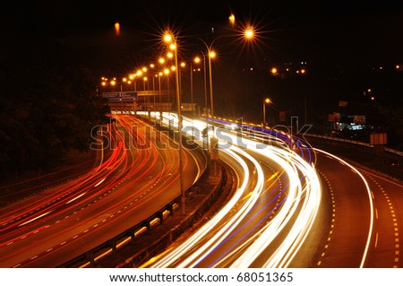light trail view at a busy highway