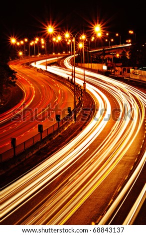 beautiful light trail at the busy highway