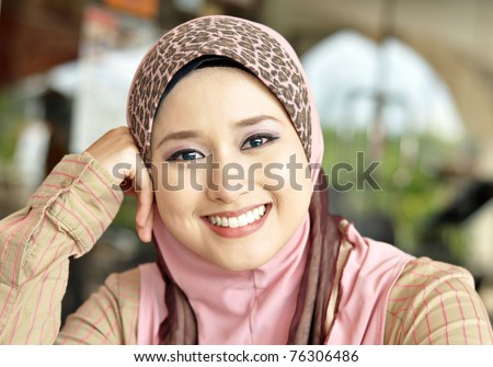 Close up of lovely Muslim girl with a sweet smile