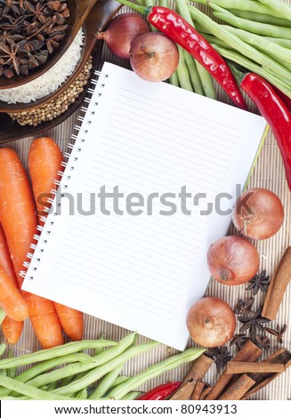 open notebook ready for writing recipe with food ingredients