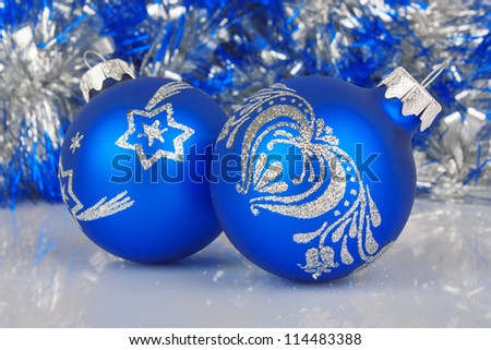 Christmas blue baubles against shiny background, New Year holiday photo