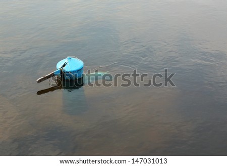 Hand water pump under water after flooding